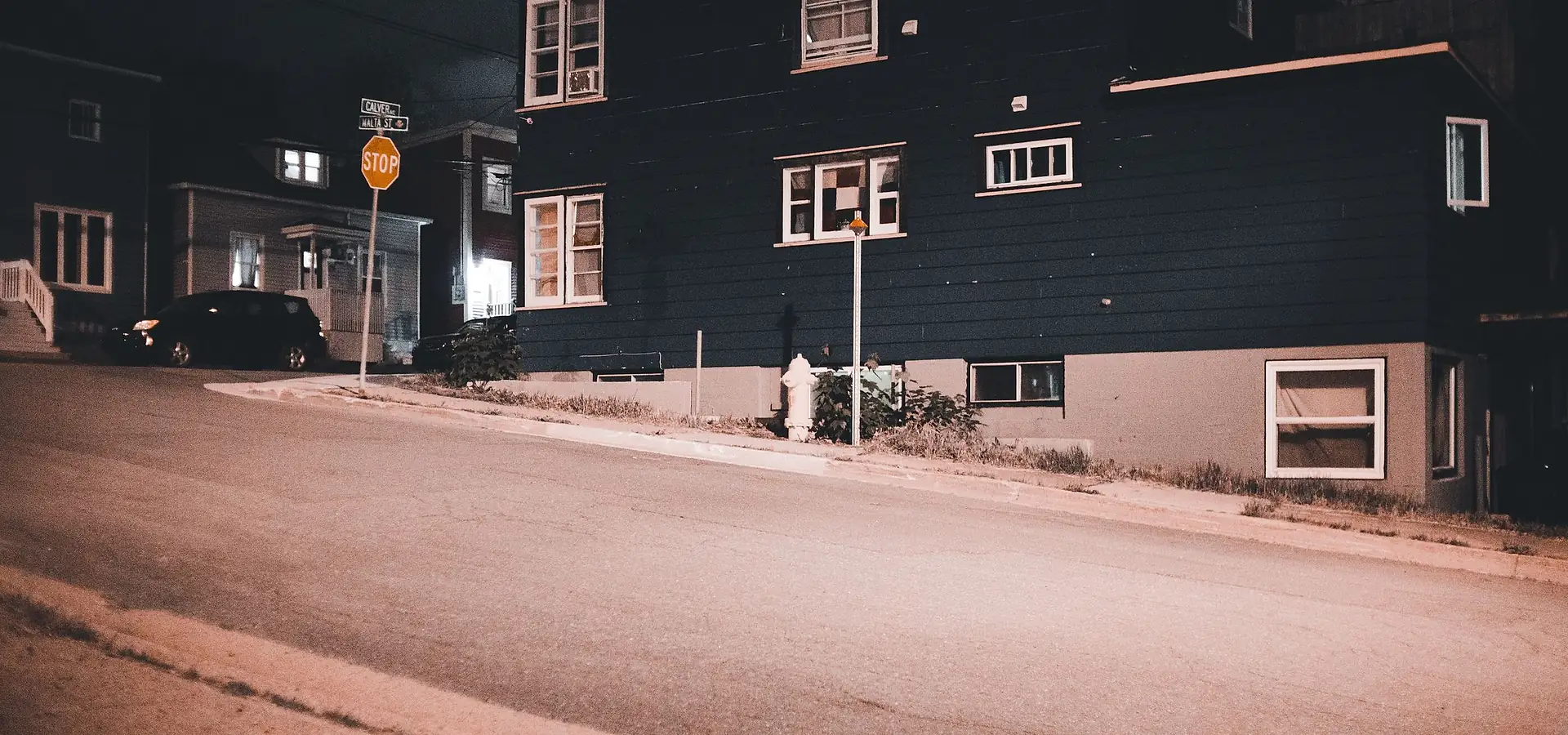 Street of low-rise buildings at dusk