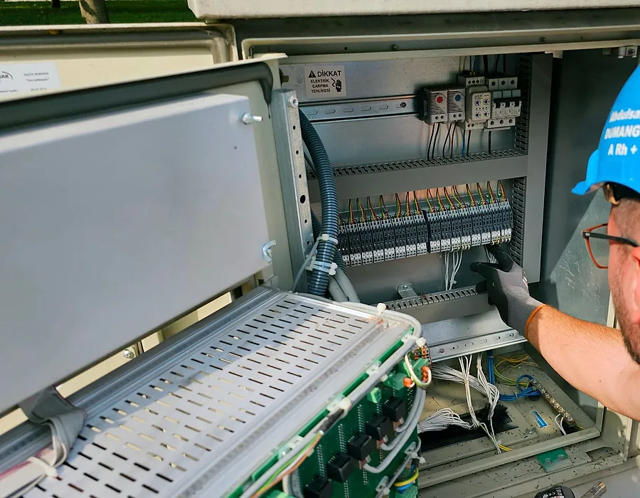 Engineer working on an industrial control panel