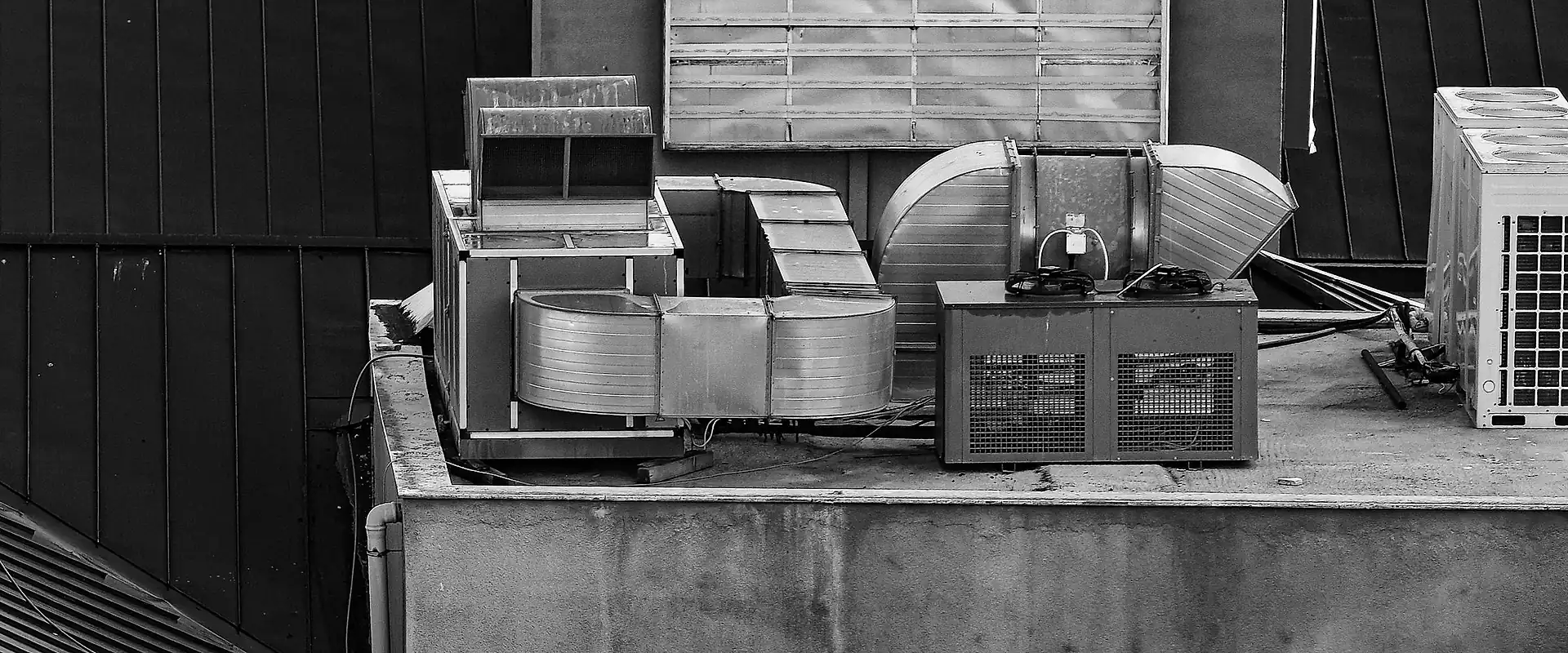 Rooftop air handling and ventilation equipment on a commercial building