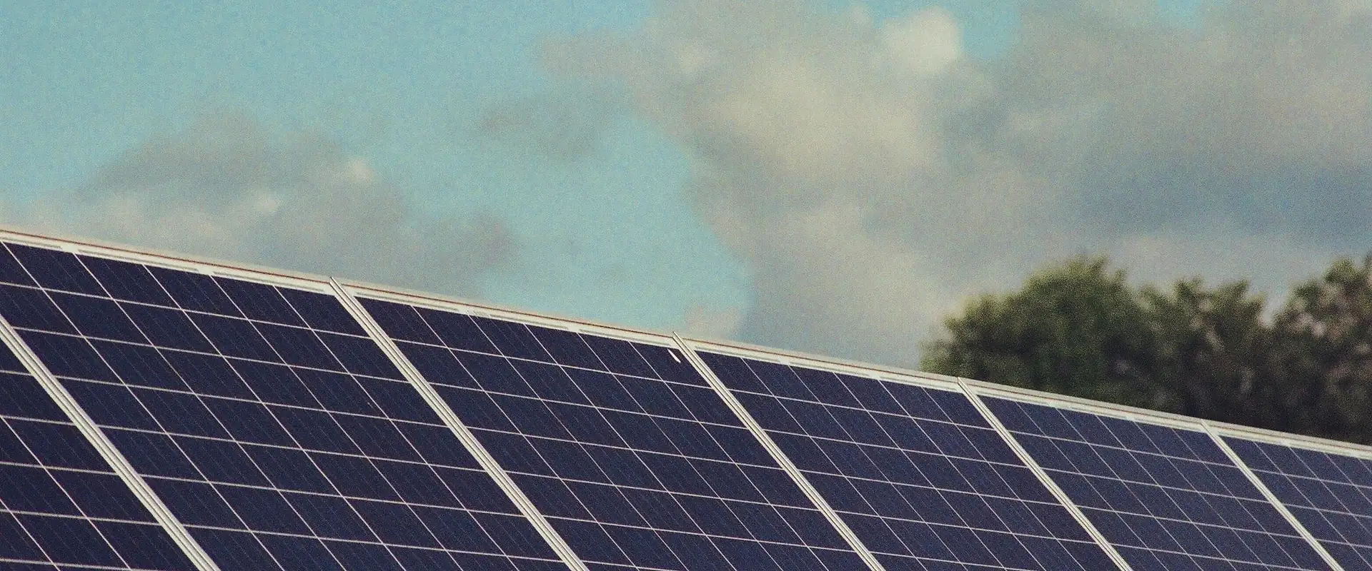 Rooftop solar panels under a clear sky