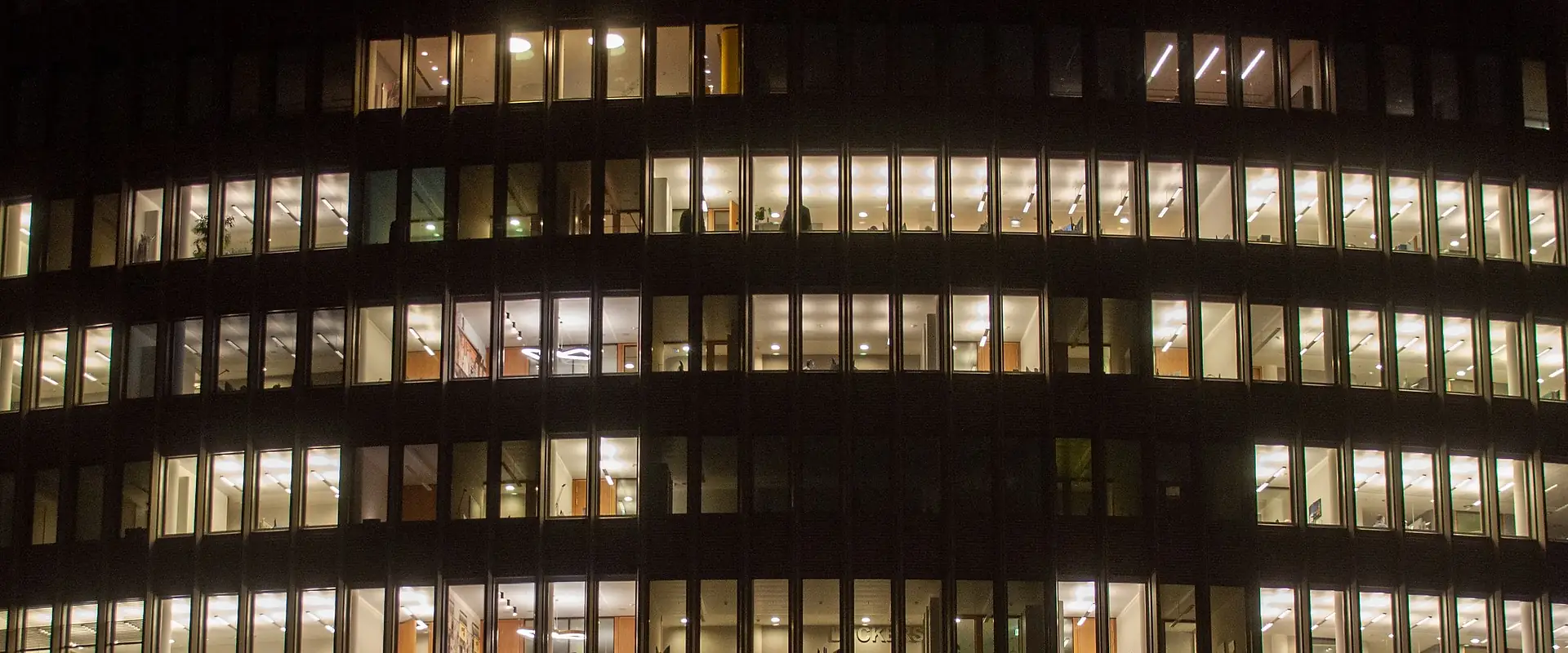 Office building with lit windows at night