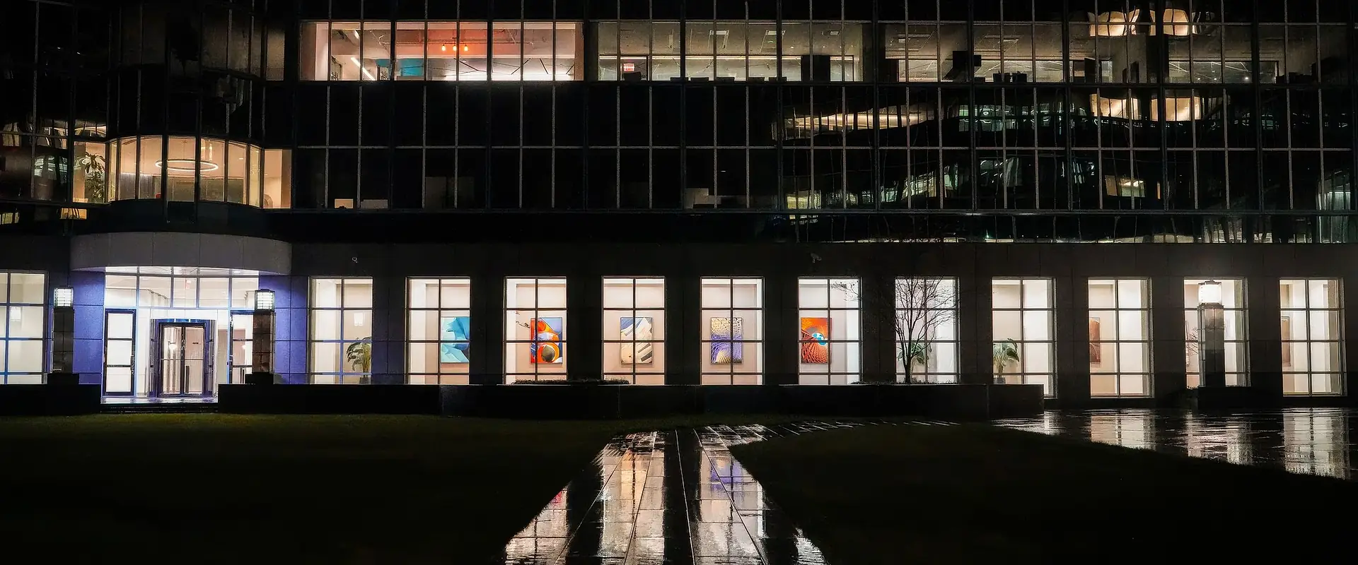 Commercial facility with illuminated offices at dusk