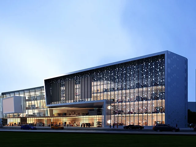 Modern commercial complex with an illuminated glazed façade