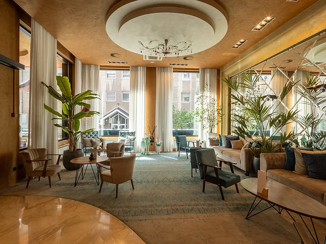 Premium hotel lounge with seating and natural light