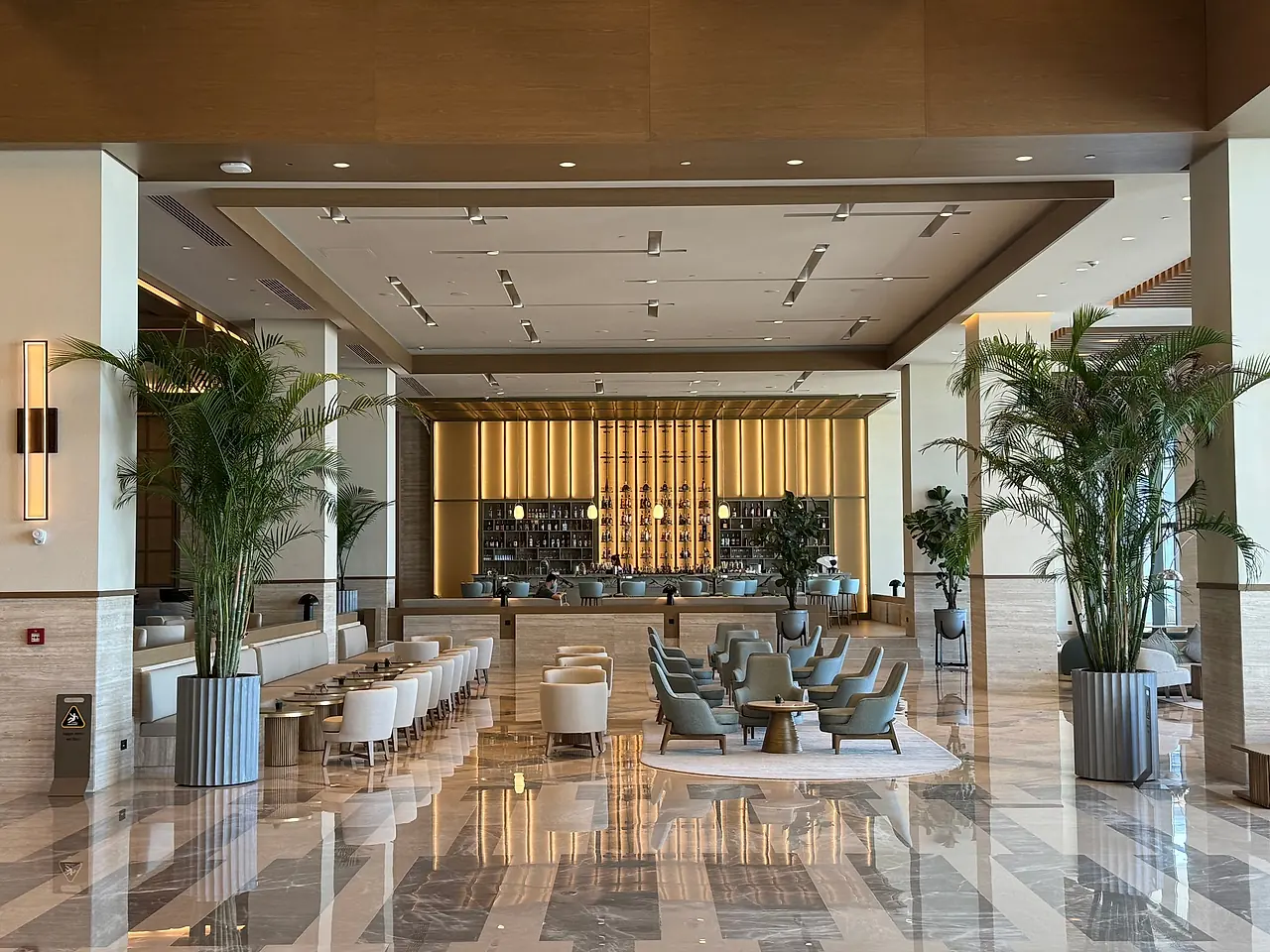 Contemporary hotel lobby with reception and lounge seating