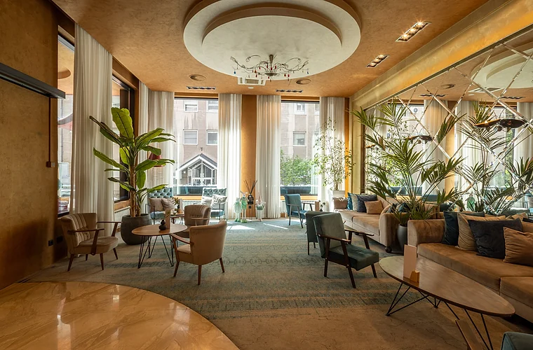 Premium hotel lounge with seating and natural light