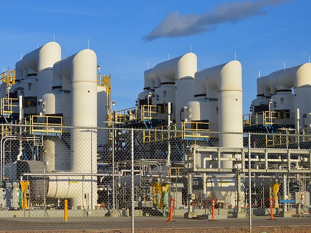 Large industrial processing facility with pipework and vessels