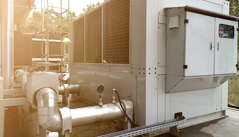 Packaged water-cooling equipment and pipework at an industrial facility