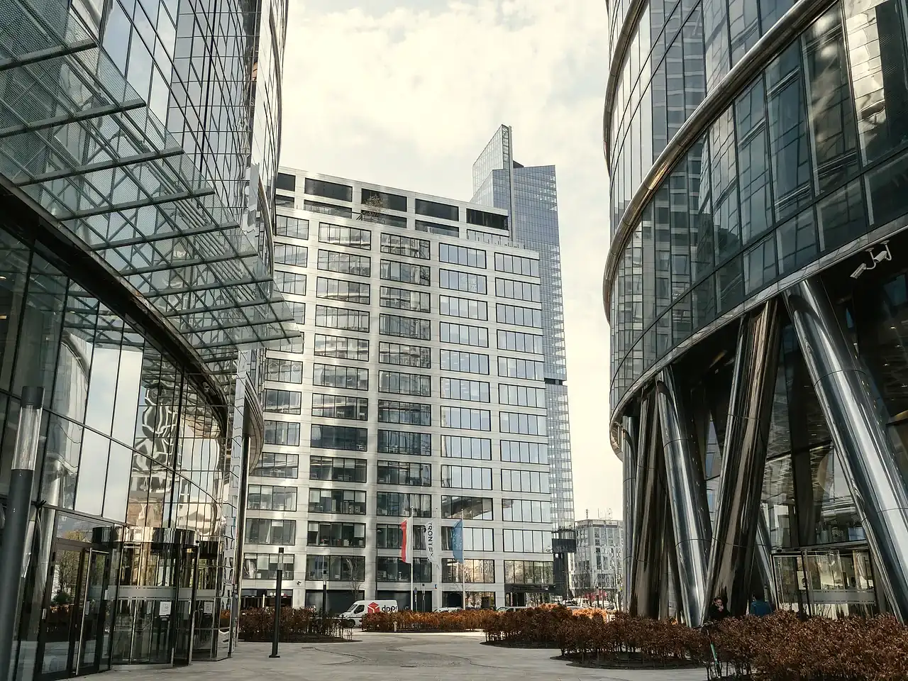 Commercial building complex with a glazed frontage and plant equipment on the roof